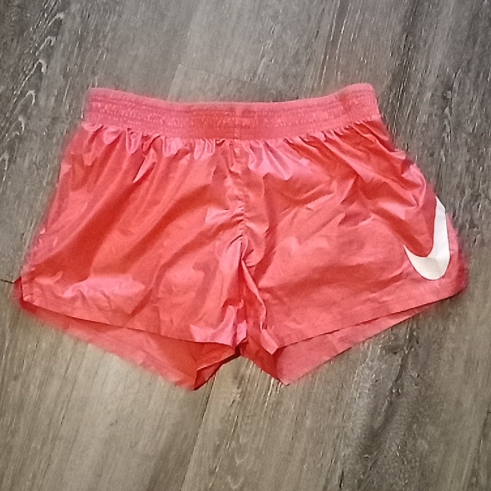 NWOT: NIKE; WOMENS ORANGE RUNNING SHORT w/ ATTCH. UNDER GUSSET & 3 1/2" INSEAM.